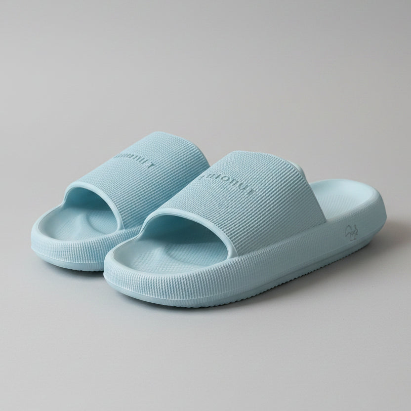 Light blue sandal with 'Cozonut' branding on a white surface.