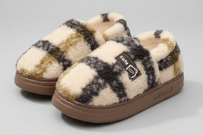 Plush and warm EVA slippers with checkered pattern on a soft surface.