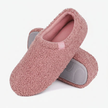 Pink slippers with gray soles on a white background