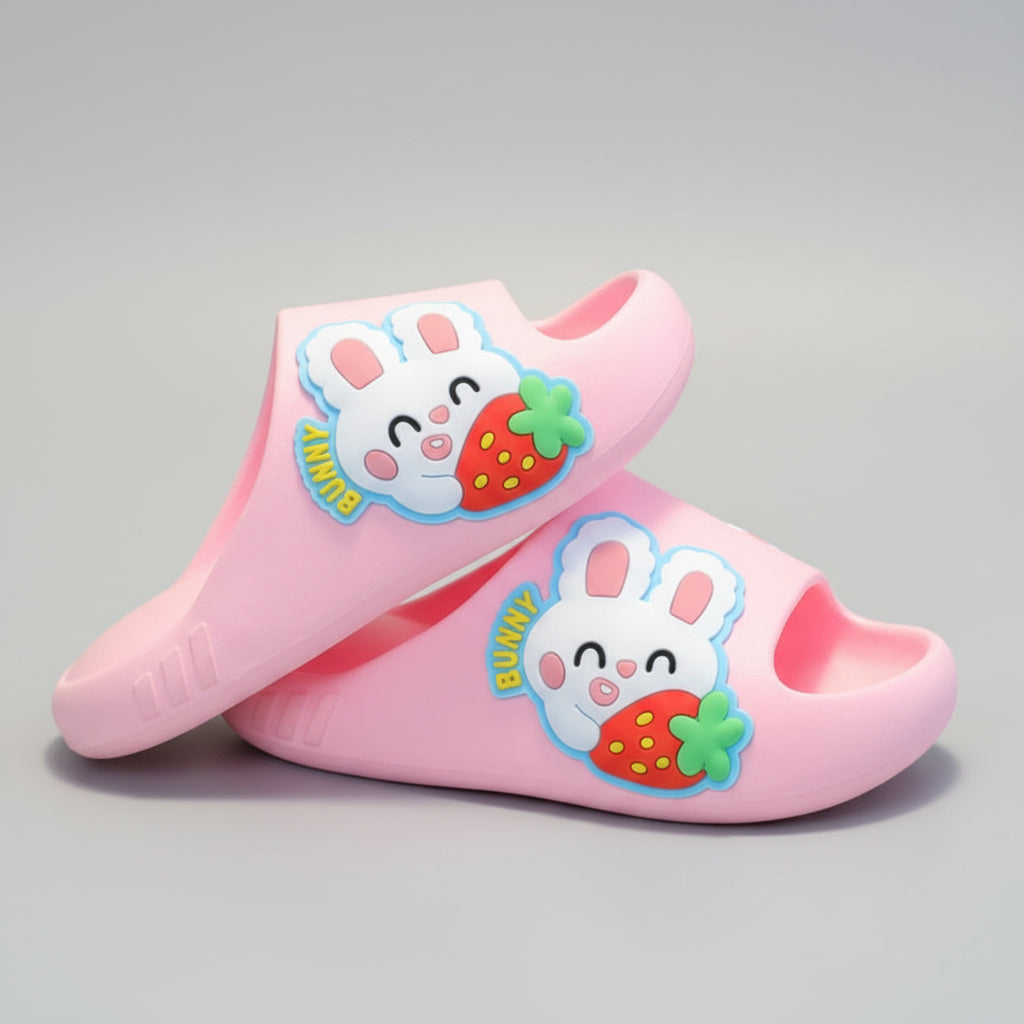 Pink children's clogs with cartoon bunny design on a gray background